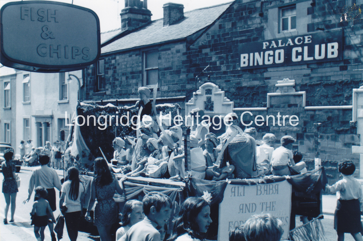 6994A - CP 67 Field Day Parade - Float passing Palace Bingo - 1970